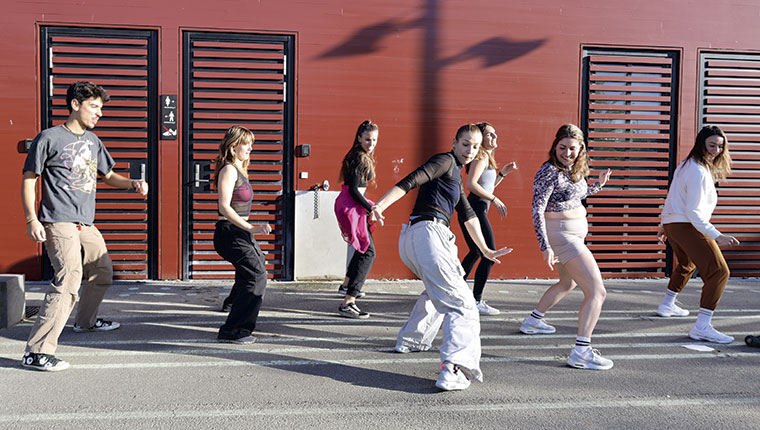 Group of young people danceing outside