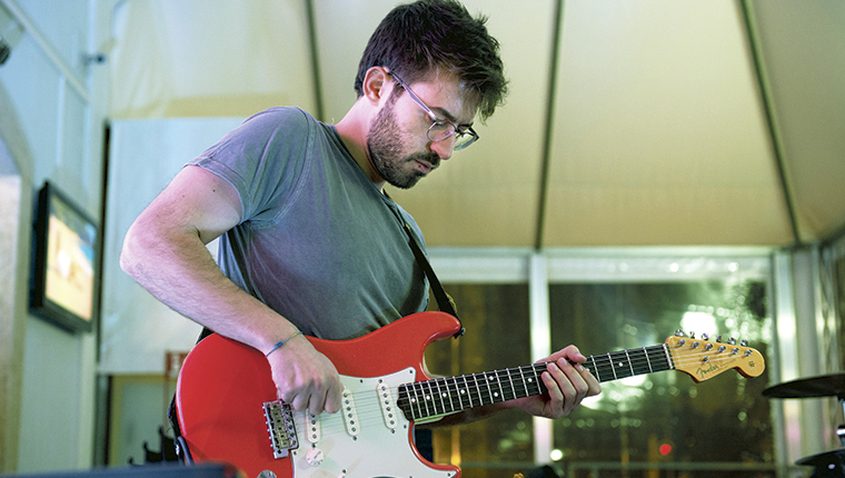 Claudio Suriano playing guitar