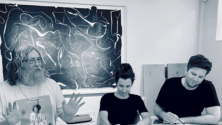 Luke Hannam teaching two students